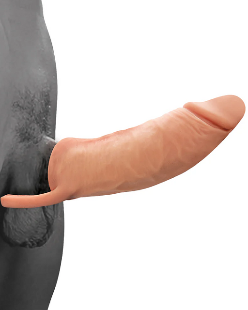 A realistic silicone prosthetic penis, known as The Great Extender 2 in 1 8 Inch Penis Extender and Stroker - Vanilla by Nasstoys, is shown attached to a person's body. The prosthetic is flesh-colored and extends outward, blending naturally with the skin. The background appears to be a neutral, grayish tone.