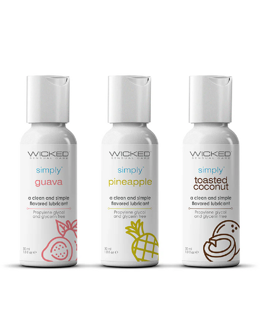Three travel-sized bottles of lubricants from Wicked Lubes' Wicked Simply Aqua Tropical Trio 1 oz are displayed in a row. From left to right, the vegan lubes feature guava, pineapple, and toasted coconut flavors. Each bottle is white with a minimalist fruit illustration matching its flavor on the label.