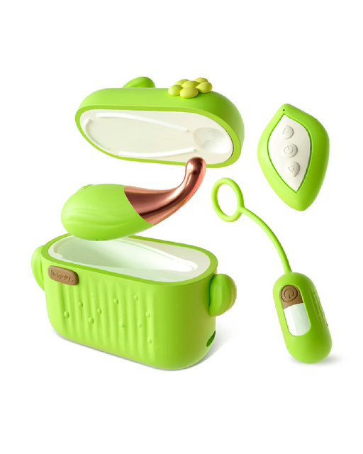 The image shows a green, cactus-themed electronic device set, including the Blooming Bliss First Time Bullet & Egg Vibrators with Charging Case & Remote by Blush, featuring a cactus-shaped storage box with an open lid, a small wireless remote control with buttons, and another small connected vibrating bullet device, laid out in a neat arrangement on a white background.