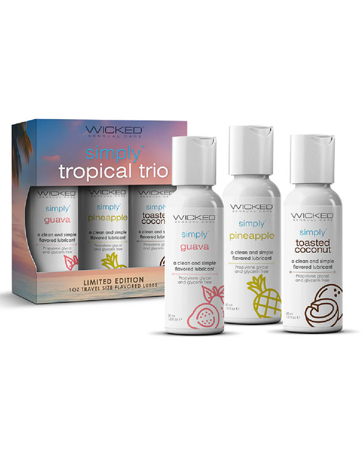 The image shows three travel-size bottles of Wicked Lubes' "Wicked Simply Aqua Tropical Trio 1 oz" set, featuring the flavors guava, pineapple, and toasted coconut. Each white bottle is adorned with a simple line drawing that represents its flavor. The packaging box is also visible.