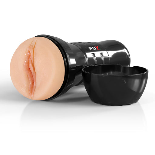 The PDX Juicy Snatch XXL Self Lubricating Stroker for Large Penises - Vanilla, a black cylindrical adult toy with a realistic flesh-toned feature and textured tunnel, is shown capless on a white surface.