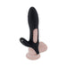 The Nautilus Rechargeable Vibrating Penis Sleeve for couples features a sleek black silicone design with a curved, hollow cylindrical space. It sits on a realistic skin-toned stand, enhancing an authentic pleasure experience, and includes remote control functionality.