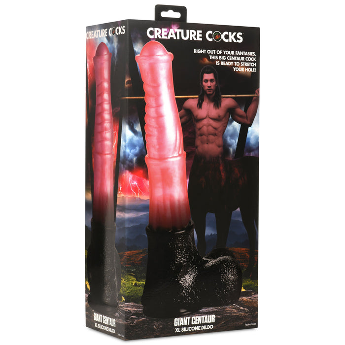 Packaging for the XR Brands "Centaur Giant 13 Inch Silicone Fantasy Horse Dildo," showcasing a large centaur-themed fantasy dildo. The box displays an image of the silicone toy, which features a pink shaft and black base with a suction cup, accompanied by a muscular man dressed as a centaur standing in a fantasy landscape.