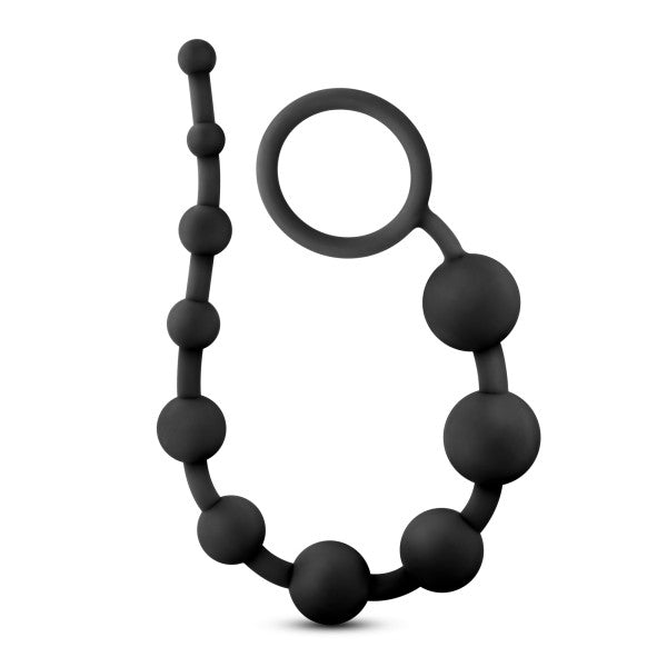 The Anal Adventures 10 Silicone Anal Beads by Blush feature a string of black, body-safe silicone beads that vary in size. The beads decrease from bottom to top and conclude with a convenient ring handle for easy retrieval. With a smooth texture, the product is showcased against a plain white background.