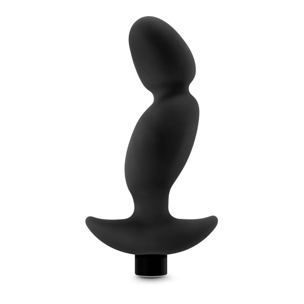 The Anal Adventures Pinpoint Silicone Vibrating Prostate Massager by Blush is a black, curved silicone anal plug featuring an ergonomic shape for comfort. It includes a 10-speed vibrating bullet to enhance stimulation, with a design that features a rounded tip, wider middle section, and flared base to ensure ease of insertion and safety.