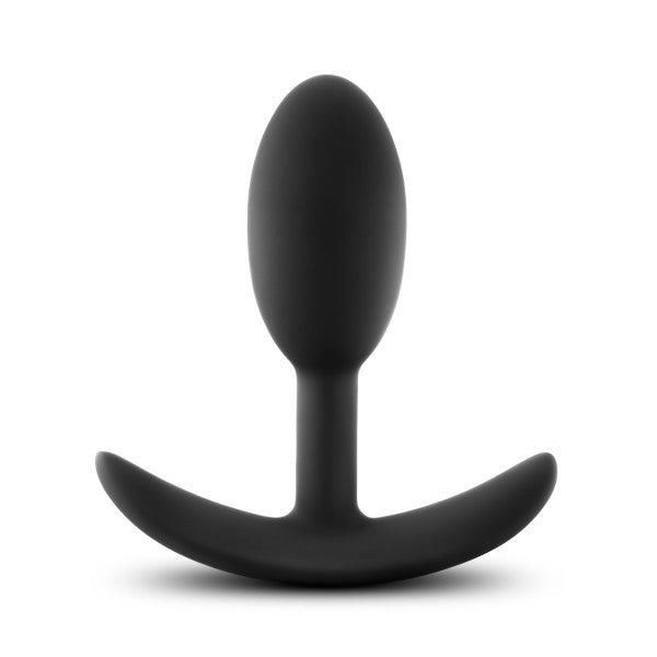 The Anal Adventures Slim Vibra Weighted Plug - Small by Blush is a black silicone butt plug featuring a smooth, tapered, and rounded insertable head made of body-safe silicone. It also has a flared base ergonomically designed for comfort and safety during use, making it an ideal plug for long-term wear.