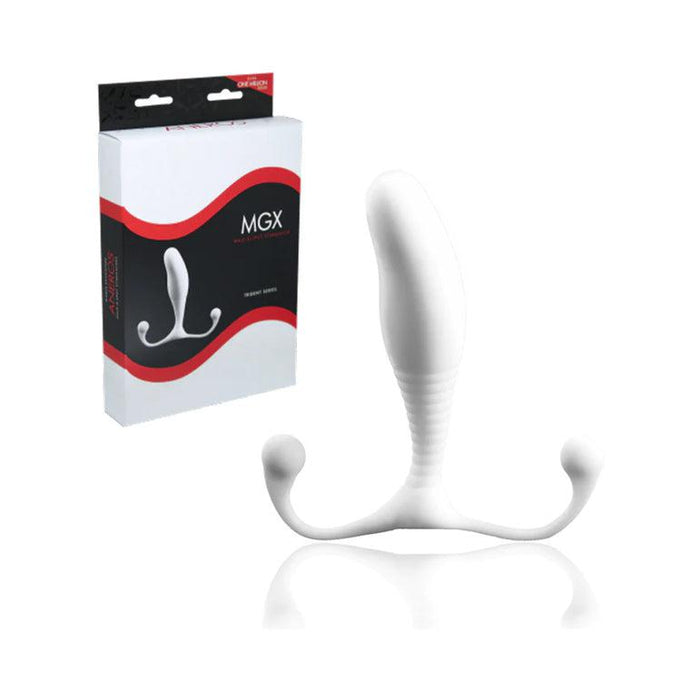 A white Aneros MGX Trident Hands-Free Prostate Stimulator with a ribbed stem, curved top part, and two bulbous arms is displayed. The packaging box, labeled "Aneros MGX Trident," is situated next to the stimulator, featuring an image of the product along with details about its prostate stimulation features on a black and red background.