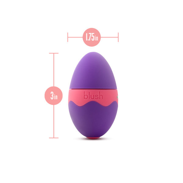 The Aria Flutter Tongue Clitoral Licking Oral Sex Vibrator by Blush is a purple, egg-shaped object with a pink middle band and 7 vibration modes. It measures 3 inches in height and 1.75 inches in width, as indicated by labeled lines and measurement markers against a white background.