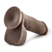 A representation of the Au Naturel 8 Inch Dual Density Suction Cup Dildo with Balls by Blush, lying on its side against a plain white background. The product, in a rich chocolate hue, features smooth textures and detailed contours that offer a realistic and elegant aesthetic.