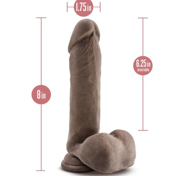 The Au Naturel 8 Inch Dual Density Suction Cup Dildo with Balls in Chocolate by Blush is a realistic brown dildo featuring a pronounced head and veins. It measures 8 inches in total length and 1.75 inches in diameter, offering 6.25 inches of insertable length. This dildo also includes testicles and has a sturdy suction cup base for hands-free play or strap-on harness compatibility.