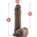 The Au Naturel 8 Inch Dual Density Suction Cup Dildo with Balls in Chocolate by Blush is a realistic brown dildo featuring a pronounced head and veins. It measures 8 inches in total length and 1.75 inches in diameter, offering 6.25 inches of insertable length. This dildo also includes testicles and has a sturdy suction cup base for hands-free play or strap-on harness compatibility.