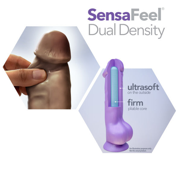 A close-up image shows a hand pressing the Au Naturel 8 Inch Dual Density Suction Cup Dildo with Balls - Chocolate by Blush, demonstrating its softness. Next to it is a sectional view of the product displaying its dual density structure: soft exterior with a firmer, pliable core. The text reads "Sensa Feel Dual Density.