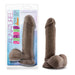 A packaged chocolate-colored Au Naturel 8 Inch Dual Density Suction Cup Dildo with Balls by Blush is displayed. The label states it is 8 inches long, soft, firm, flexible, and has a realistic shape with a pronounced head and textured surface. Designed for versatility, it features a strap-on compatible suction cup base.