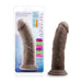 The product description for the Au Naturel 8 Inch Realistic Feel Dual Density Suction Cup Dildo in Dark Chocolate, manufactured by Blush, highlights its packaging and product image. The packaging emphasizes the dildo's soft, firm, and flexible nature. This realistically textured dildo is displayed both in its packaged form and unpackaged state.