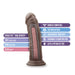 The "Au Naturel 8 Inch Realistic Feel Dual Density Suction Cup Dildo - Dark Chocolate" by Blush is showcased in an image, highlighting its dual-density material with a soft brown outer layer and a firm inner core. Labels emphasize its flexible shaft, gentle exterior, compatibility with harness play, suction cup base for added stability. Additionally, it is lab-certified and free of latex, phthalates, fragrances, and paraffins.