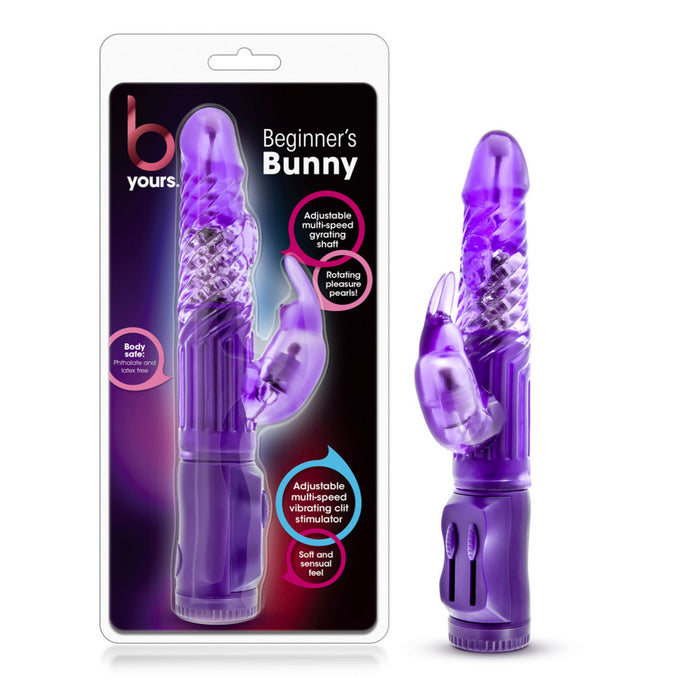 A packaged B Yours Beginner Bunny Rabbit Vibrator from Blush in a vibrant purple color. This waterproof vibrator features a curved shaft with textured ridges, a smaller clitoral stimulator with bunny ears, and adjustable speed controls. The packaging emphasizes its multiple vibration settings and beginner-friendly design.