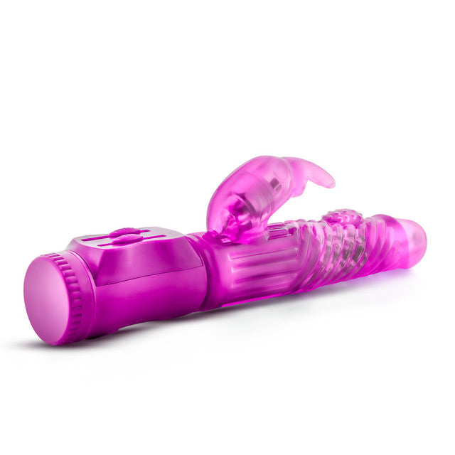 The B Yours Beginner Bunny Rabbit Vibrator by Blush comes in a variety of colors and is designed for beginners. This rabbit-style vibrator features multiple vibration settings, textured ridges, a small external stimulator, and a waterproof design. Its curved shape enhances internal stimulation while the base provides easy-to-use controls for an enhanced experience.