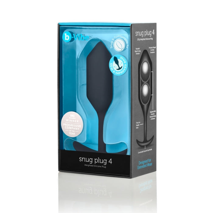 A packaged black B-Vibe Snug Plug 4 XL Weighted Silicone Butt Plug (9 oz) from b-Vibe, ideal for anal play, is displayed. The blue box features a large window showcasing the product and includes text like "Designed for Extended Wear" and "2X Winner Progressive Company of the Year.