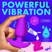 A hand holds the BANG! Rotating & Vibrating Silicone Butt Plug with Remote from XR Brands, made of silky smooth silicone, against a blue and pink backdrop with text that reads "POWERFUL VIBRATION." The image highlights features like 10 vibration patterns, 13,000 RPM motor, waterproof (PX6), compatibility with water-based lubricant, and 3 speed settings.