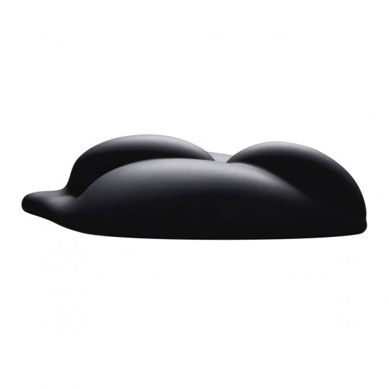 A smooth, black Bananapants B.Cush Textured Universal Dildo Base for Harness Play with organic, rounded forms resembling a reclining figure or undulating landscape against a plain white background, evokes the sensuality of strap-on play.