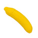 A bright yellow, banana-shaped object with a glossy silicone finish is shown against a white background. The object is the Banana Emojibator Ultra Discreet First Time Bullet Vibrator by Dame Products, designed to split into two parts with a top cap that mimics the shape of a banana tip.