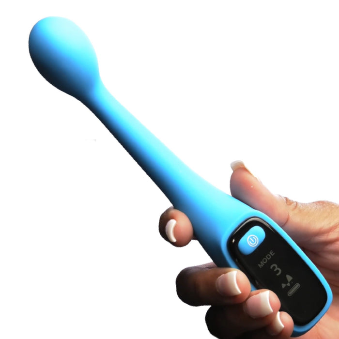 A hand holds the Bang! First Time G-Spot Vibrator with Digital Display by XR Brands, featuring a light blue, elongated design with a bulbous end. The black control panel displays "MODE 3" and includes mode buttons as well as an illuminated power button. This USB rechargeable personal care or wellness product is designed for first-time users.