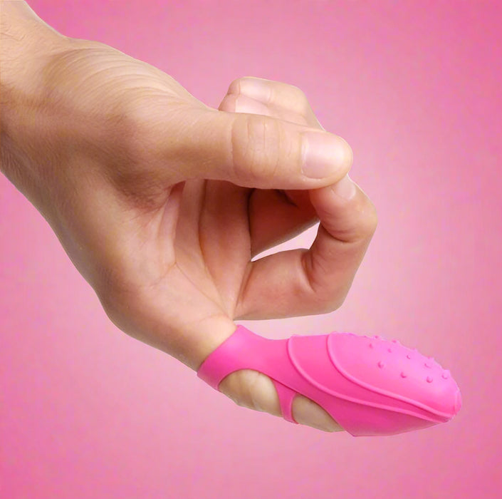 A hand with a thumb pointing up, wearing the Bang Her Silicone G-Spot Finger Vibrator by XR Brands in pink, featuring a textured silicone TPE/TPR cover.