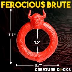 The Beast Mode Fantasy Cock Ring by XR Brands is a red circular object with a snarling face and two horns at the top, made of stretchy silicone. It has an inner diameter of 1.6 inches, an outer diameter of 2.7 inches, and a total height of 3.5 inches. Text on the image reads "FEROCIOUS BRUTE" at the top and "CREATURE COCKS" at the bottom.