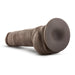 An image of the Blush Big Boy 10 Inch Dual Density Suction Cup Dildo in Chocolate, presented laying flat to showcase its detailed vein and skin-like textures. The rounded base features a suction cup for hands-free use, making it ideal for strap-on play.