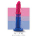 A vibrant dildo in shades of pink, purple, and blue, representing the bisexual pride flag, is displayed against a corresponding background. The Bisexual Pride 7.5 Inch Silicone Suction Cup Dildo from Blush is made of platinum-cured silicone and features a strong suction cup base. Text at the bottom reads "P8 LOVE BISEXUAL PRIDE.