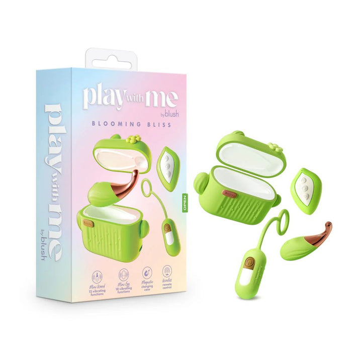 A product image of the Blooming Bliss First Time Bullet & Egg Vibrators with Charging Case & Remote by Blush. The green set includes a compact mirror and a discreet vibrating egg with a wireless remote control, all elegantly packaged with the product name and vibrant graphics.