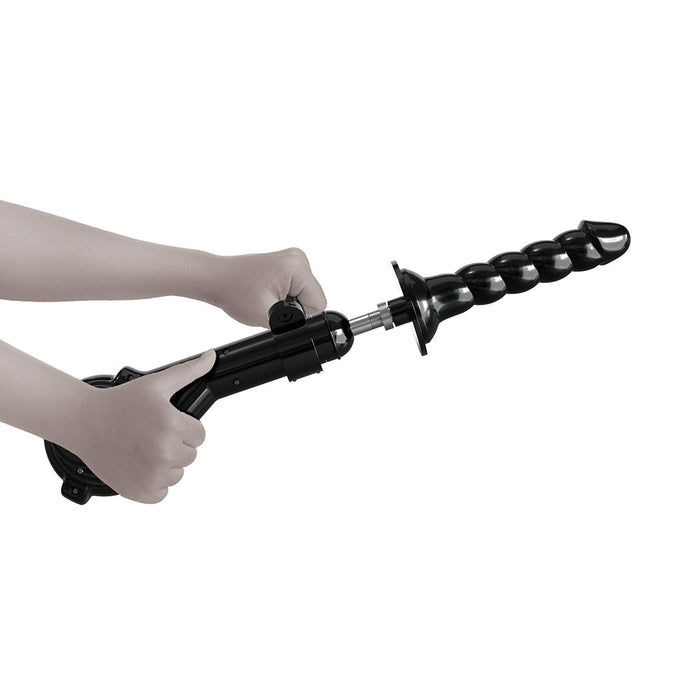 Two hands are holding what looks like a mechanical or industrial device, reminiscent of the Body Dock Thrusting Sex Machine with Remote by Pipedream Products. This black, drill-like object includes a spiral attachment with visible knobs and a robust handle for gripping, suggesting its role as an advanced thrusting sex machine.