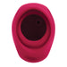 A close-up view of the pink silicone rubber ring from the Body Kisses Red Suction Masturbator and Vibrator by Evolved Novelties, featuring a hole in the center and showcasing its smooth, curved edges.