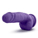 The Bold Beefy 7 Inch Dual Density Suction Cup Dildo by Blush is a realistic purple dildo with a pronounced head and vein details. It features a dual density design and a thick girth for added sensation. The base is equipped with a suction cup for easier handling or attachment to surfaces. The toy is shown against a plain white background.