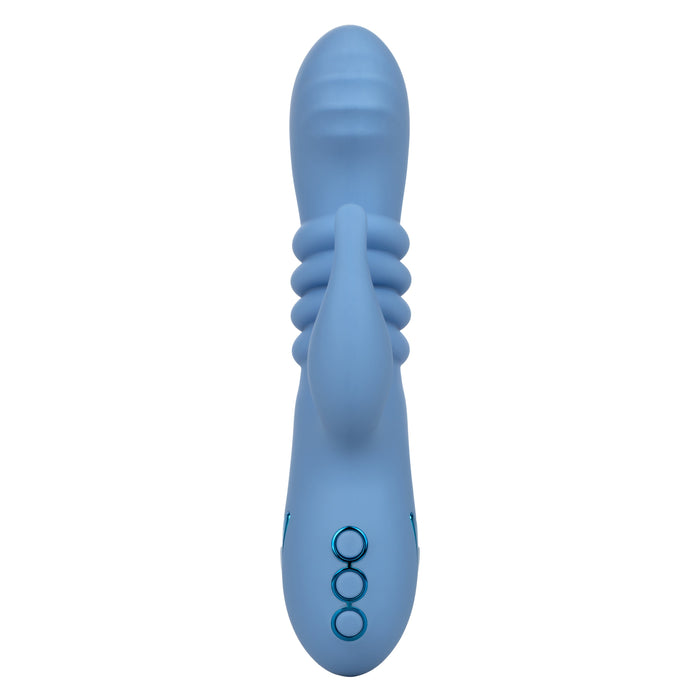 The California Dreaming Santa Cruz Coaster Thrusting G-Spot Rabbit Vibrator by CalExotics is a blue handheld personal massager that features three buttons and a textured design near the head. The device has a smooth surface, an extended structure along the main body, and includes a clitoral arm for added stimulation.