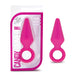 The pink, small-sized "Candy Rimmer Beginner Silicone Butt Plug" by Blush is made from body-safe, flexible silicone. It features a conical tip and a circular handle for easy removal. Ideal for anal play, the product is depicted both inside and outside of its transparent packaging.