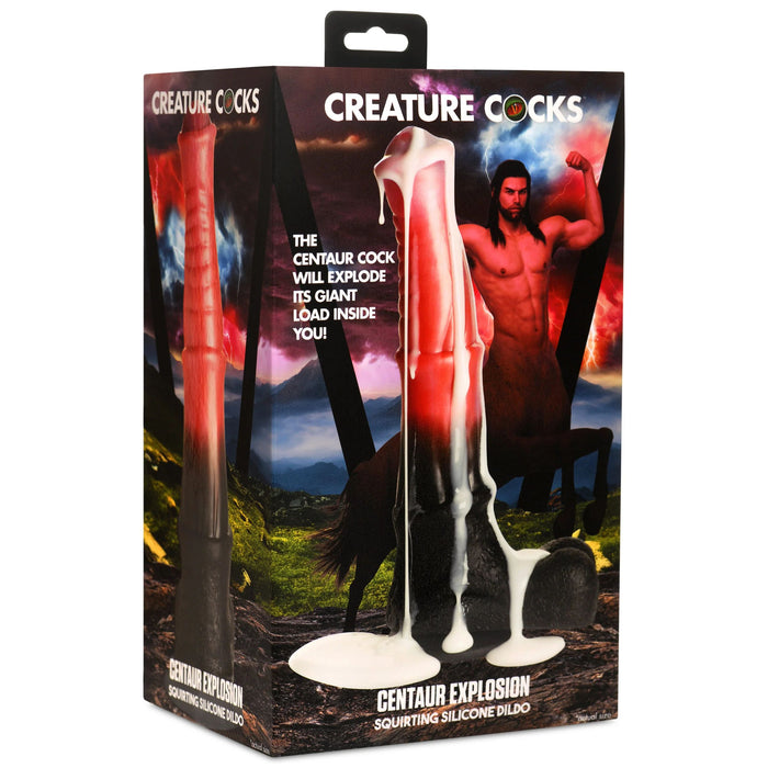 The image showcases a product box with the Centaur Explosion Squirting 9.5 inch Silicone Fantasy Horse Dildo positioned upright, featuring a suction cup base for stability. The packaging includes illustrations of a centaur and prominently displays the product name "CREATURE COCKS" by XR Brands. Text on the box highlights the product’s squirting fluids functionality.