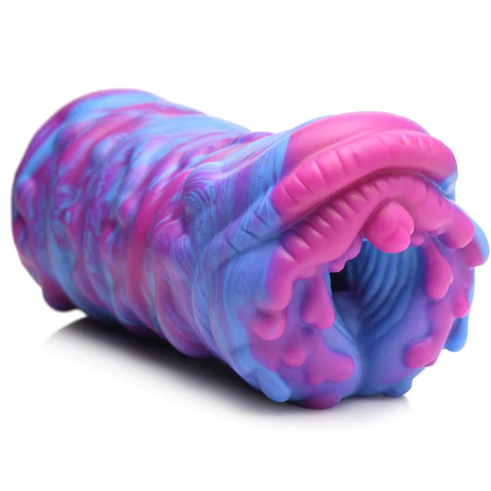 The Cyclone Squishy Alien Vagina Role Play Stroker by XR Brands is a colorful premium silicone toy showcasing a complex texture with swirling patterns of pink, purple, and blue. The tubular shape features varied surface textures, including grooves and ridges. The opening reveals a textured inner tunnel with intricate detailing for an extraordinary experience.