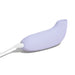 The Dame Aer Clitoral Pressure Wave Vibrator in purple from Dame Products is displayed. It features a curved, streamlined, and ergonomic design for comfortable use. The battery-powered device is connected to a white charging cable plugged into its base and incorporates advanced pressure wave technology for enhanced clitoral stimulation.