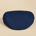 A Dame Pillo Sex Pillow for Sex Positioning - Indigo placed against a beige background. The cushion, reminiscent of a wedge-shaped pillow, has a flat top and a slightly elevated, supportive outer edge, designed for comfortable seating during meditation or yoga practices.