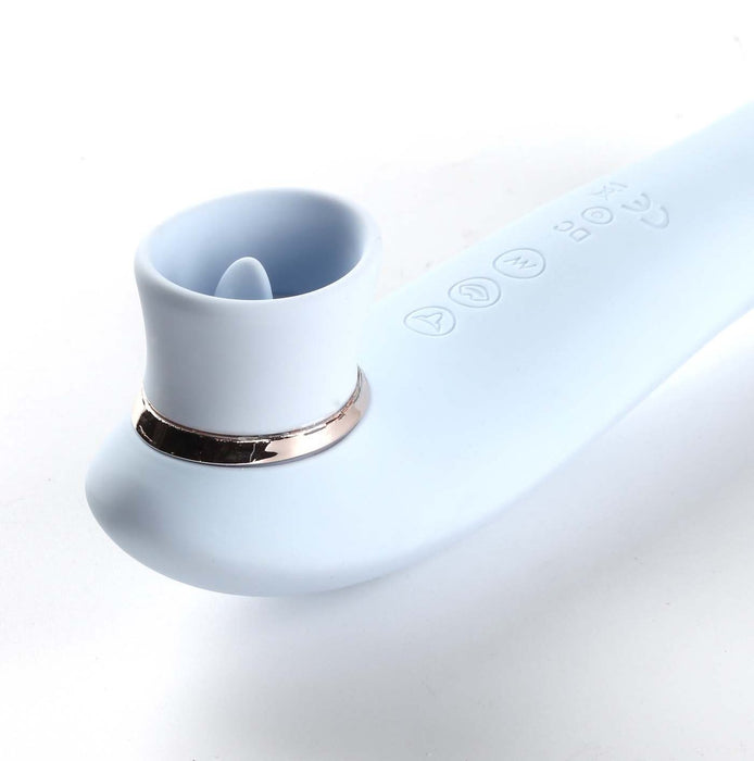 The Destiny Blue Clitoral Suction Vibrator with Tongue by Maia Toys is a sleek, light blue personal massager with a curved design. This clitoral sucking toy features a circular opening at one end and has a row of control buttons along its handle, including power and function buttons. It boasts a modern look with a metallic ring near the opening.