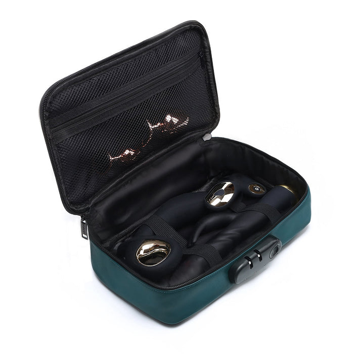 The Dorcel Lockable Discreet Emerald Green Storage Box from Lovely Planet is a semi-open black and green travel case with a mesh zipper pocket in the lid, containing a pair of sleek black and gold massagers. These massagers are securely placed inside the padded compartment of this discreet storage box, which features an additional lock on the side for enhanced security.