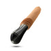 The Dr. Arthur Vibrating Thrusting Gyrating Realistic Silicone Dildo - Caramel by Blush features a black and beige design. It has a rounded black handle and a flesh-toned, cylindrical silicone insertable section that is body-safe. The insertable section includes a ribbed area near the base and transitions to a smooth texture toward the tip for realistic thrusting pleasure.