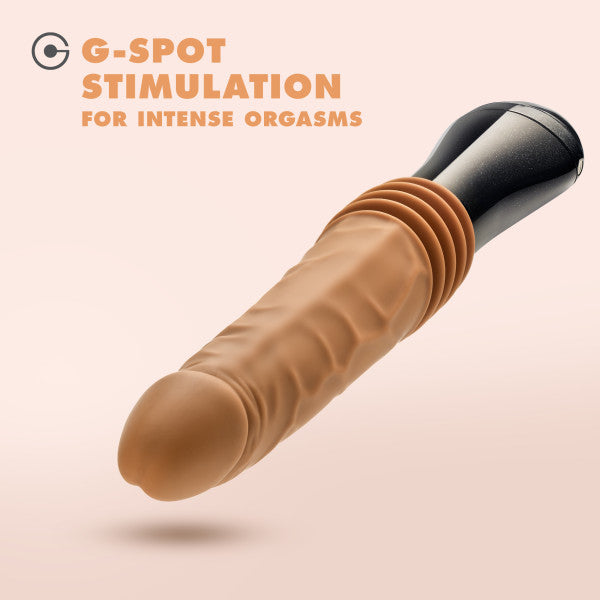 The Dr. Arthur Vibrating Thrusting Gyrating Realistic Silicone Dildo - Caramel by Blush is showcased against a light pink background, highlighting its lifelike appearance and curved shaft designed for G-spot stimulation. In bold, orange letters at the top left corner, the text "G-Spot Stimulation for Intense Orgasms" stands out. This body-safe toy offers three powerful speeds for personalized pleasure.