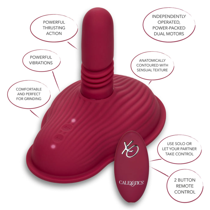 The Dual Rider Remote Control Thrust & Grind Humping Vibrator by CalExotics is a red, ergonomically contoured adult toy designed with a flexible, textured base and a protruding shaft. It features dual motors, powerful vibrations, and a remote control thrust function. Text around the toy highlights its comfort, power, and versatility for both solo and partnered use.