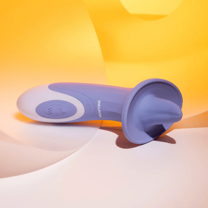 A blue and white Lix & Kisses Swirling Tongue Oral Sex Vibrator from Evolved Novelties, featuring a curved shape and a suction end, is placed on a yellow and white abstract background. Made from phthalate-free silicone, the vibrator has a sleek, smooth finish. The brand name "Evolved Novelties" is visible on the side of the device.