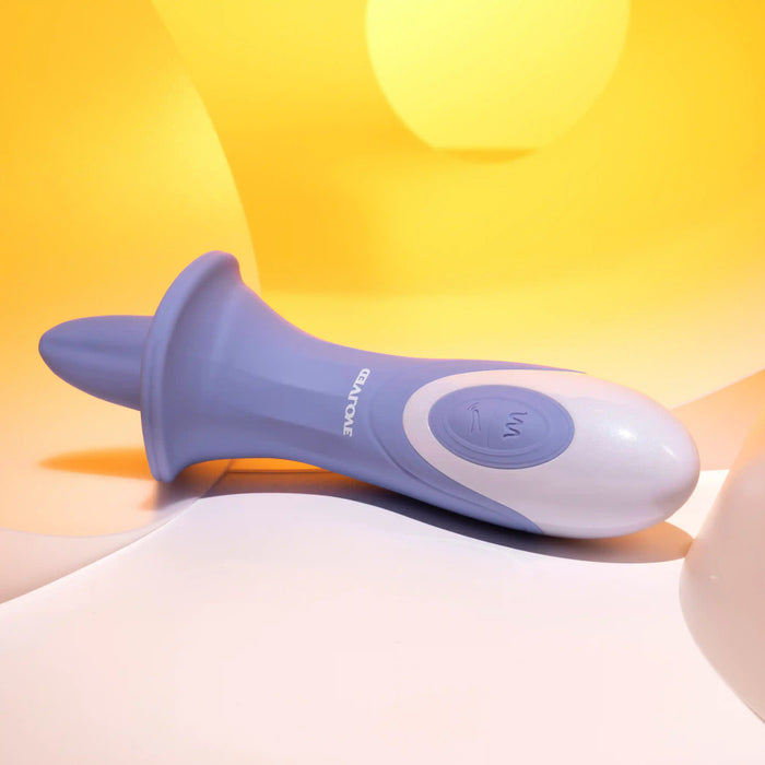 The Lix & Kisses Swirling Tongue Oral Sex Vibrator by Evolved Novelties is a blue and white handheld device with a rounded, elongated shape and a flared base, resting on a yellow and white background. Made from phthalate-free silicone, it features a button with a wave icon in the middle and provides vibrating tongue sensations for added pleasure.