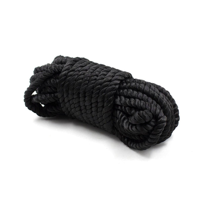 A neatly coiled length of thick black rope, part of the Everything Bondage 9 Piece Beginner's Bondage Kit by Ple'sur, made from a twisted synthetic material, is positioned against a plain white background. Ideal for a bondage kit, the rope is tightly wound and has a smooth, glossy finish.