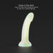 A glow-in-the-dark, phallic-shaped object stands upright against a dark background. Text above the object states, "Fantasia Glow in the Dark 7 inch Silicone Dildo," and below it, "Only 5 minutes after being introduced to natural or artificial lighting." Ideal for G-spot play by Lovely Planet.