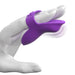 A close-up image shows a hand holding the Fantasy For Her Waterproof Purple Finger Vibrator by Pipedream Products, highlighting its butterfly shape as it wraps around the index and middle fingers, with part of it extending past the fingertips. This alluring accessory offers 10 unique vibration patterns for your pleasure against a plain white background.